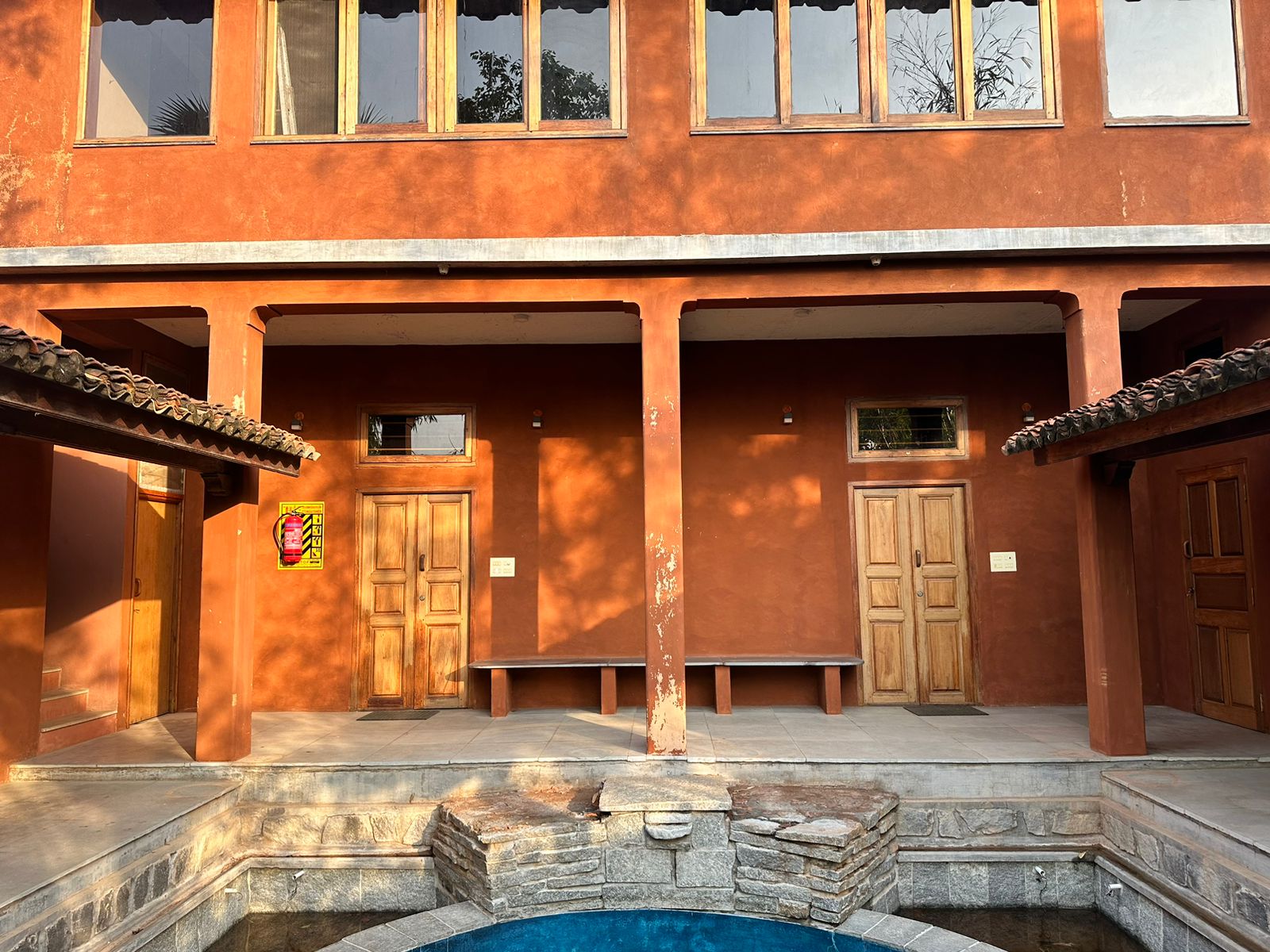 Terracotta courtyard and plunge pool at Arunamangala Retreat